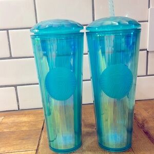Two matching Starbucks, iridescent, mermaid Starbucks cups.